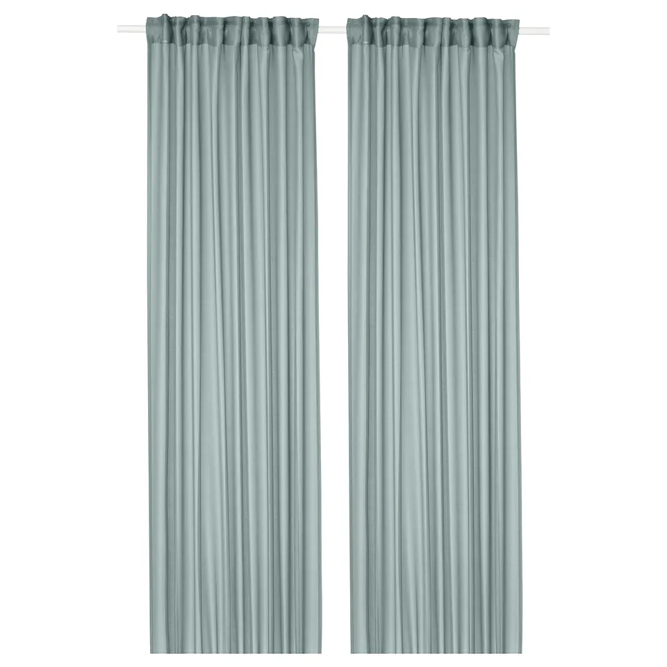 Stenfro turquoise sheer curtains, made from recycled polyester, hang straight and soften light, giving a coastal vibe.