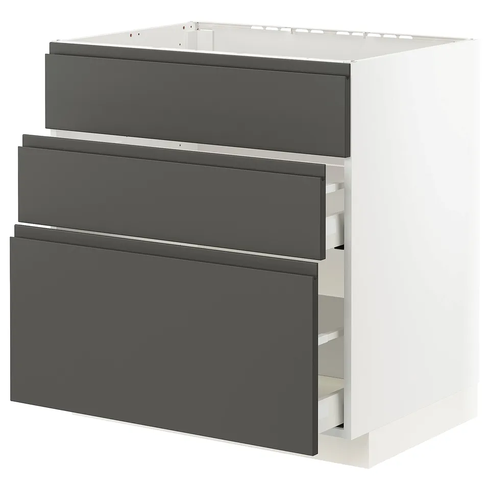 Modern white kitchen unit with grey drawers, sturdy and sleek design, ideal for storage.