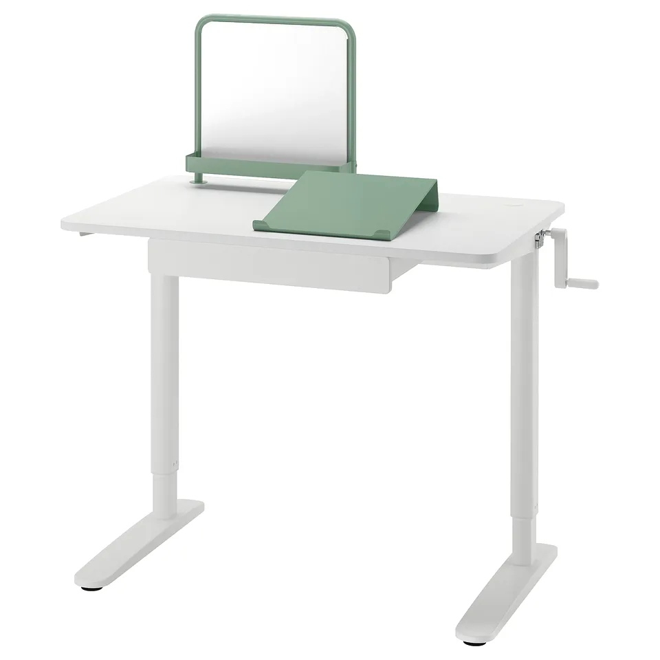 Modern white adjustable desk with green accessories: holder, pad, magnet board. Ideal for kids study, crank height adjuster.