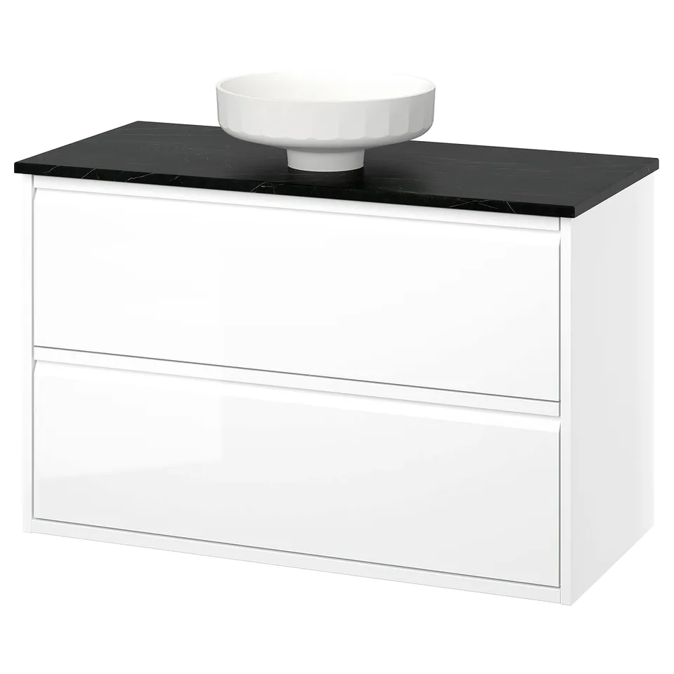 Modern white bathroom cabinet with sleek black countertop and bowl.
