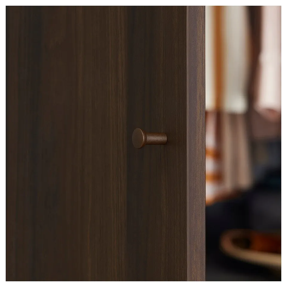 Brass-knobbed dark wood cabinet