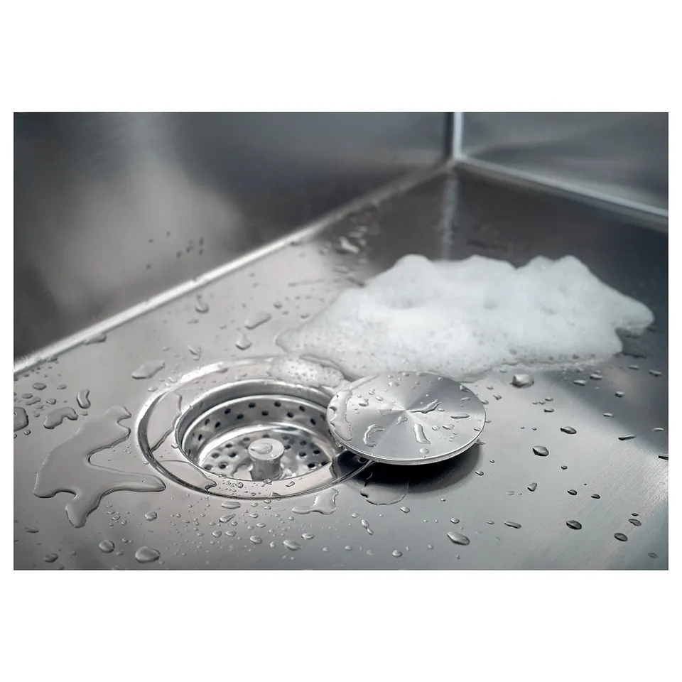 Stainless steel sink lid magnetically attaches, keeping sink clean and neat.