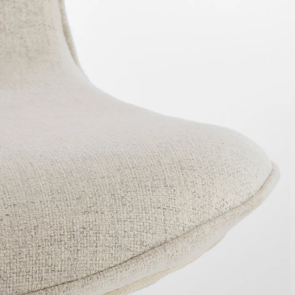 Close-up of LÅNGFJÄLL chairs cushioned seat, showing fine fabric texture and stitched edges, highlighting comfort and quality.