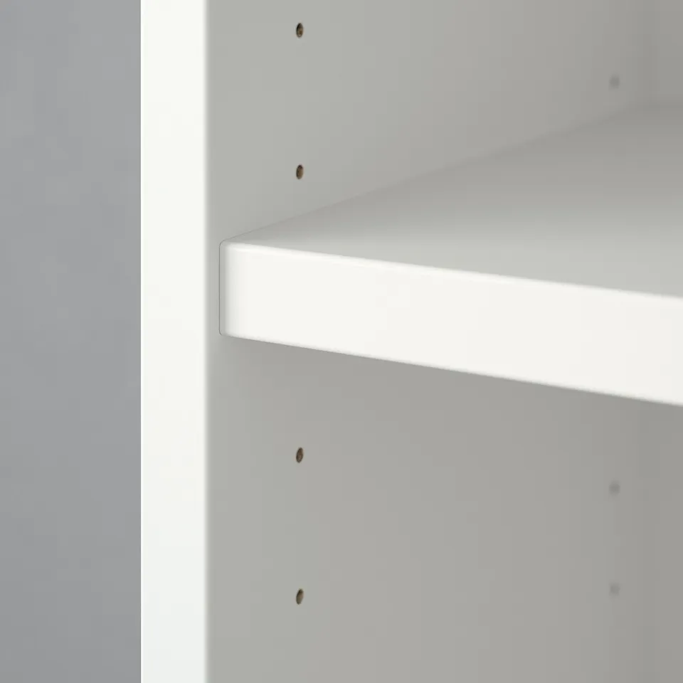 A section of a white BILLY bookcase with clean lines and adjustable shelves.