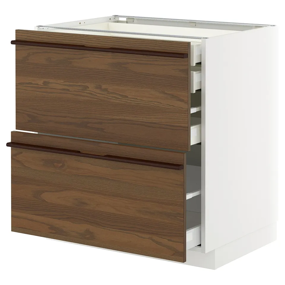 METOD kitchen cabinet with dark brown wood drawers and white base.