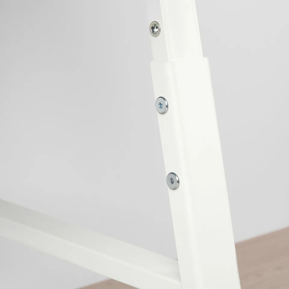 Close-up of a white metal table leg with three visible bolts securing it, showcasing sturdy construction.