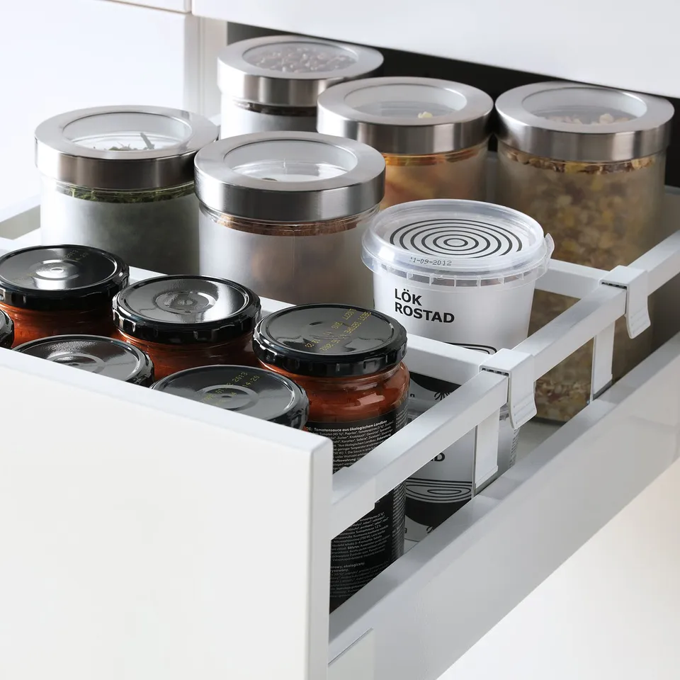 Kitchen drawer with labelled containers, adjustable shelves, full extension, soft close.