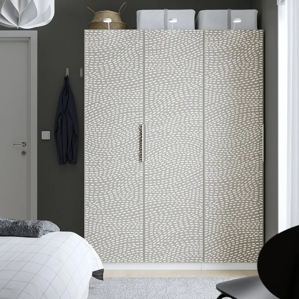 Grey MISTUDDEN wardrobe in bedroom, offering ample storage.