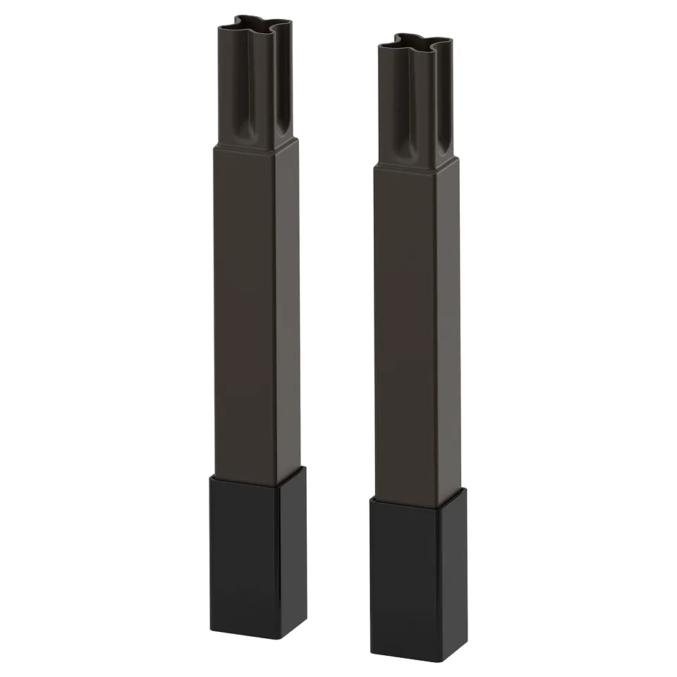 Two black ENHET kitchen legs, each adjustable, standing upright, sleek and modern in design.