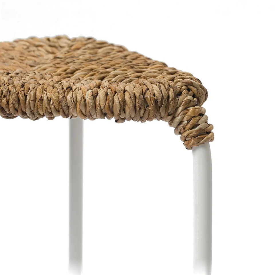 Close-up of finely woven banana fibre stool, showcasing intricate craftsmanship.