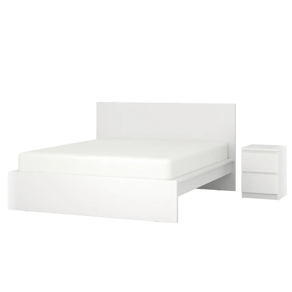 White MALM bed and bedside table. Modern, minimalist design with sleek lines.