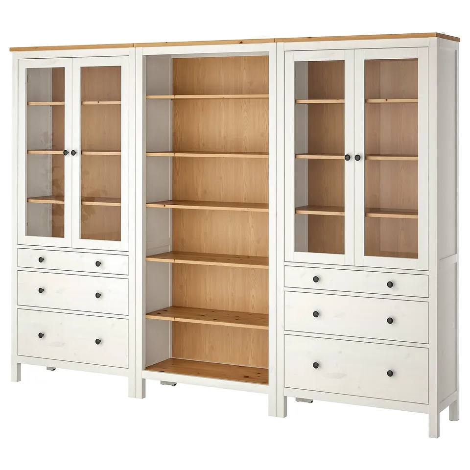 HEMNES white display cabinet, combining solid pine wood for classic look, featuring glass doors and ample storage.