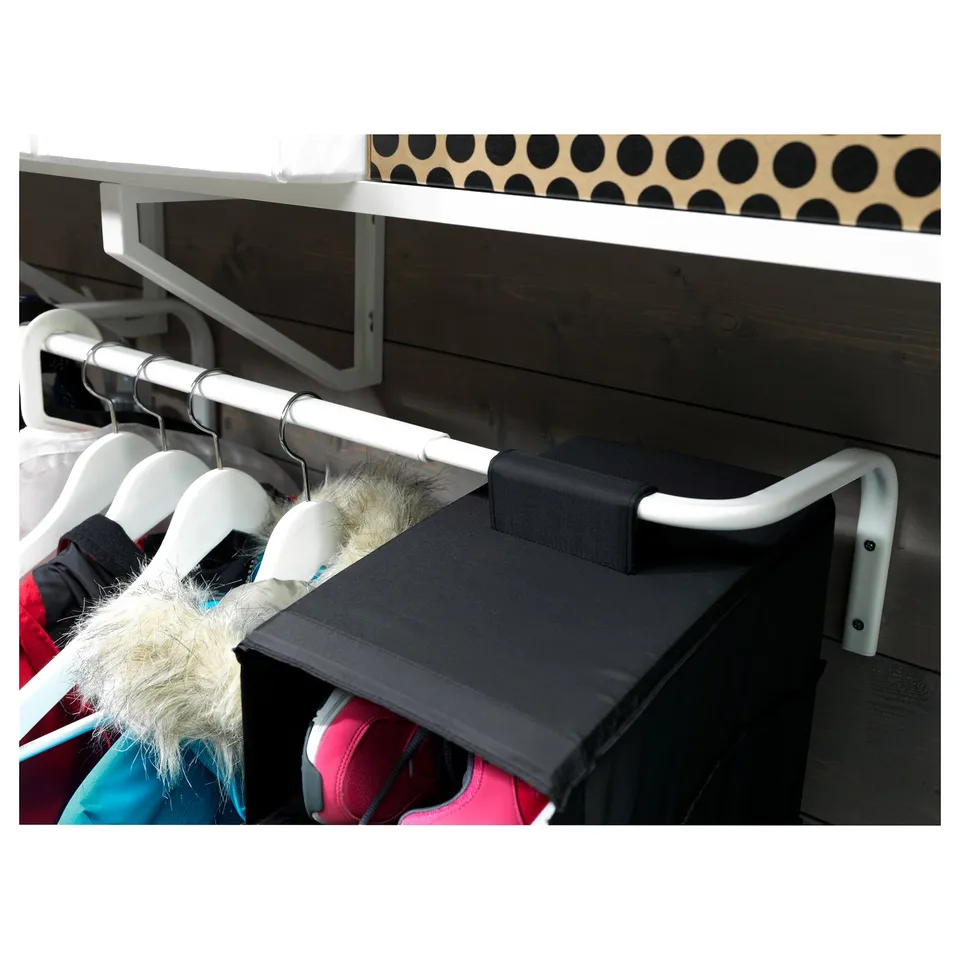 A MULIG clothing rail in white, with hangers and clothes displayed.