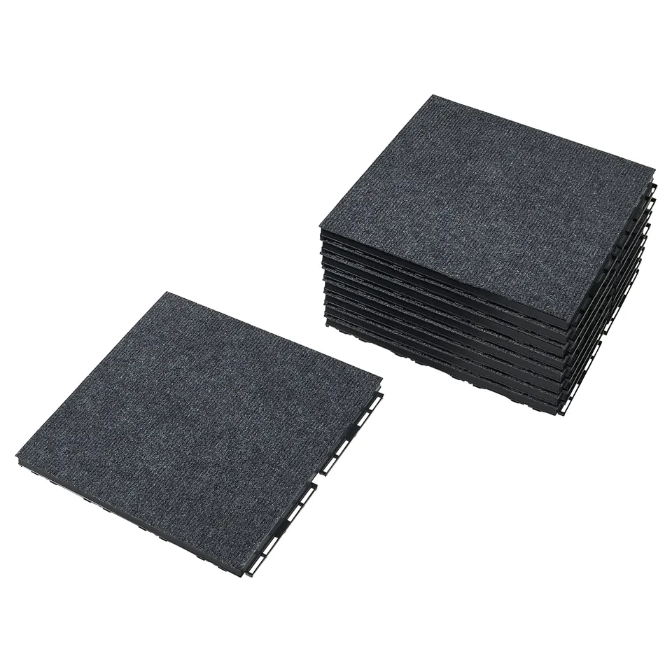 Stack of black interlocking square floor tiles made of recycled polyester and plastic, designed for easy assembly.