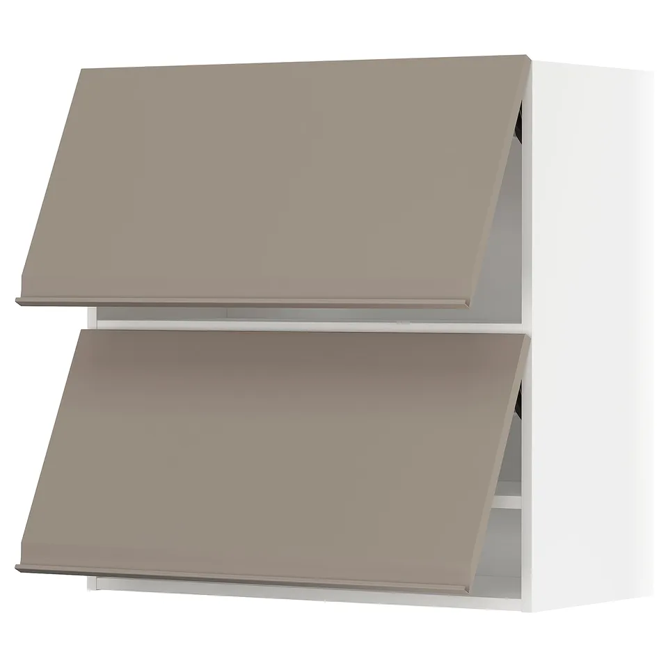 Two tan-colored kitchen cabinets with angled tops and built-in handles, stacked vertically.