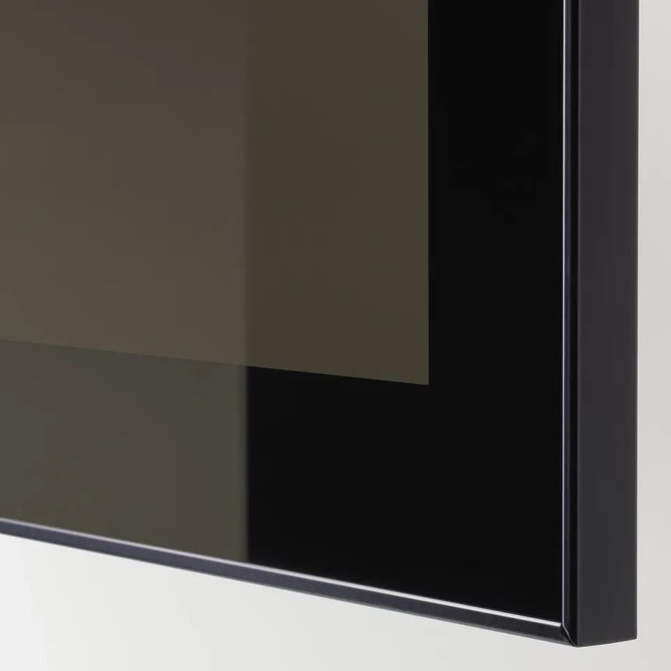 Close-up of modern, sleek cabinet with reflective glass doors, showing high-quality construction and finish.