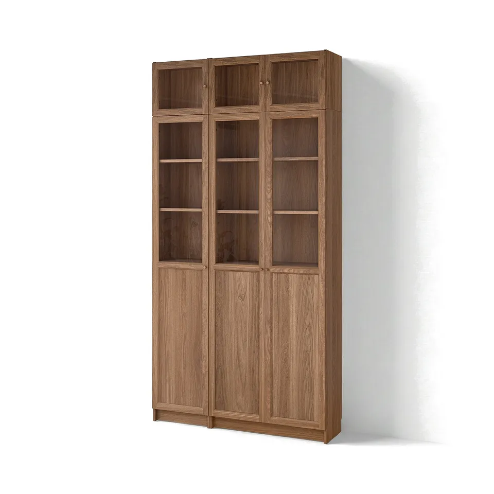 Tall wooden BILLY bookcase, light brown, glass doors, rectangular, modern design.