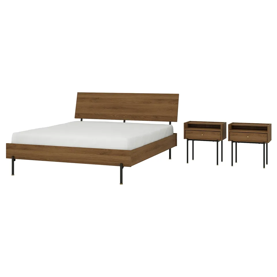 Mid-century walnut bed and bedside table set with clean lines and brass accents.