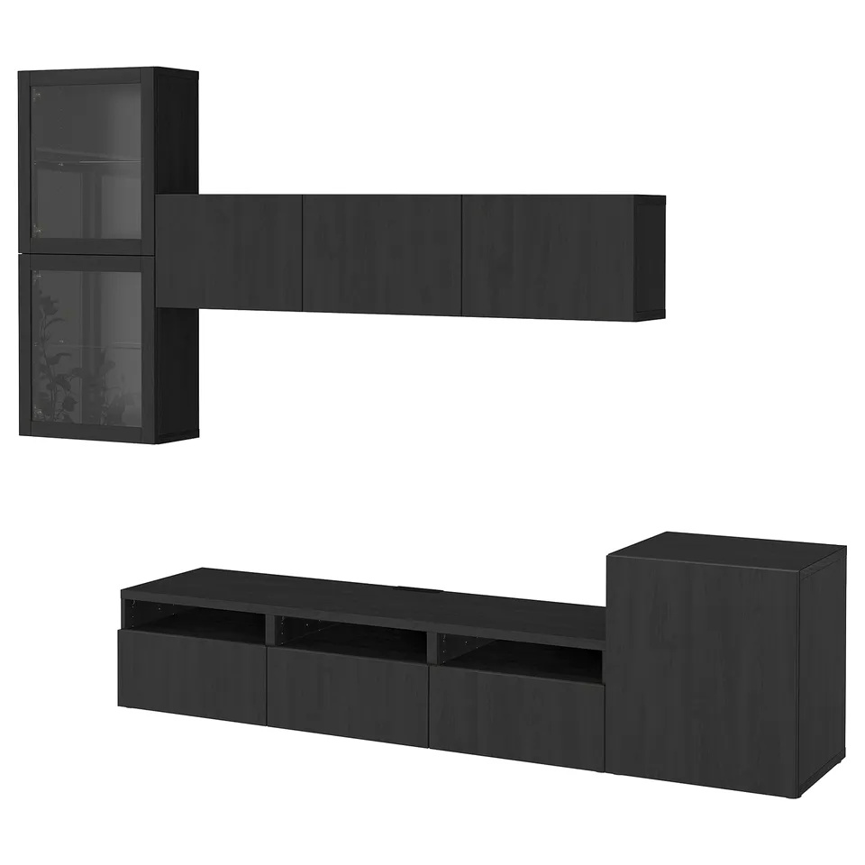 Black BESTÅ tv/storage combo with shelves and drawers, sleek and modern design.