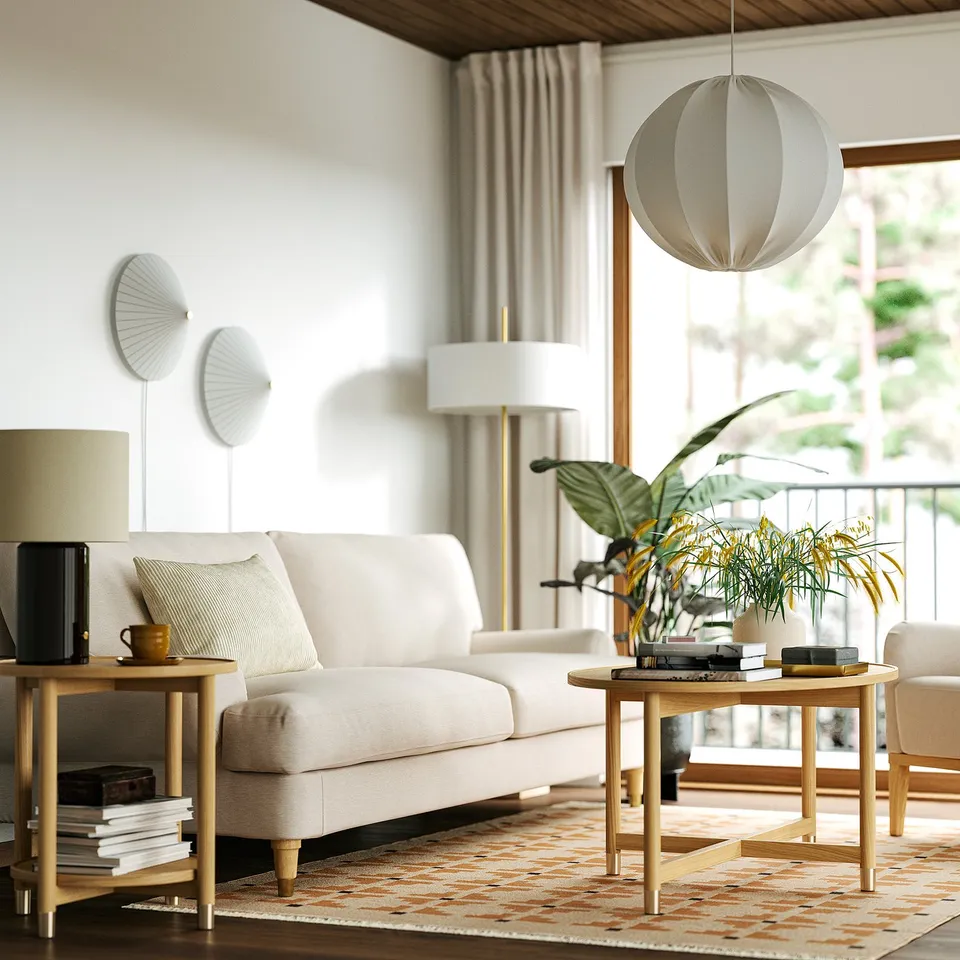 White sofa with pillows, wooden tables, spherical lamp, wall lamps, patterned rug, plants, books, coffee mug.