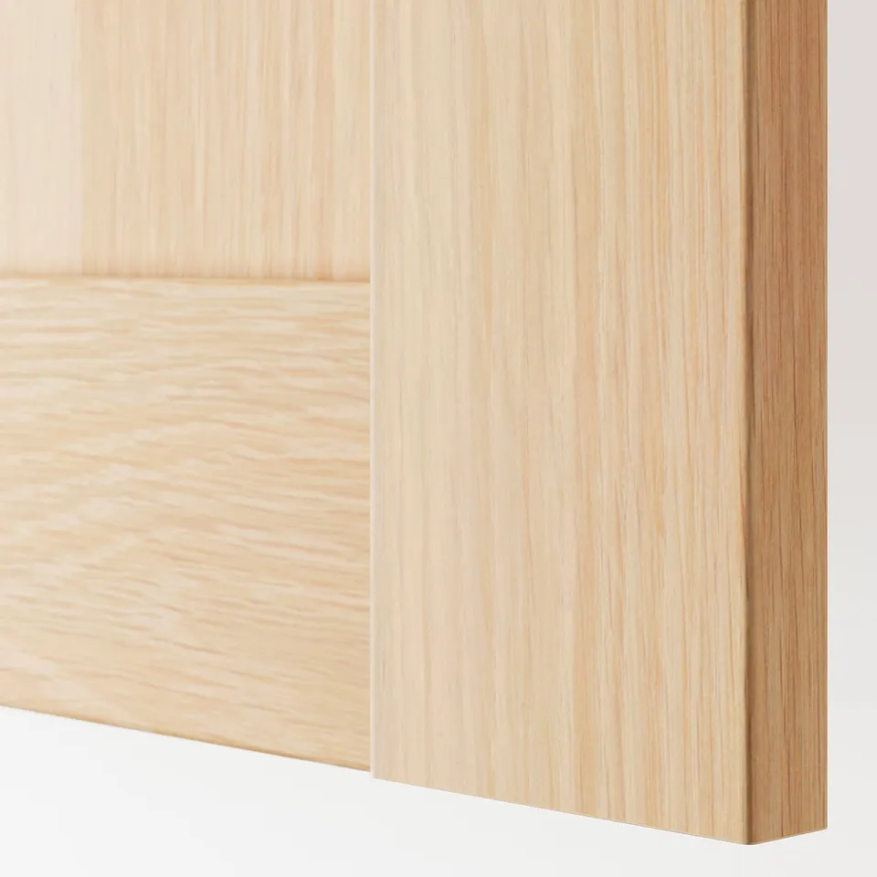 Close-up of light honey-colored wood panel, smooth finish, horizontal grain visible.