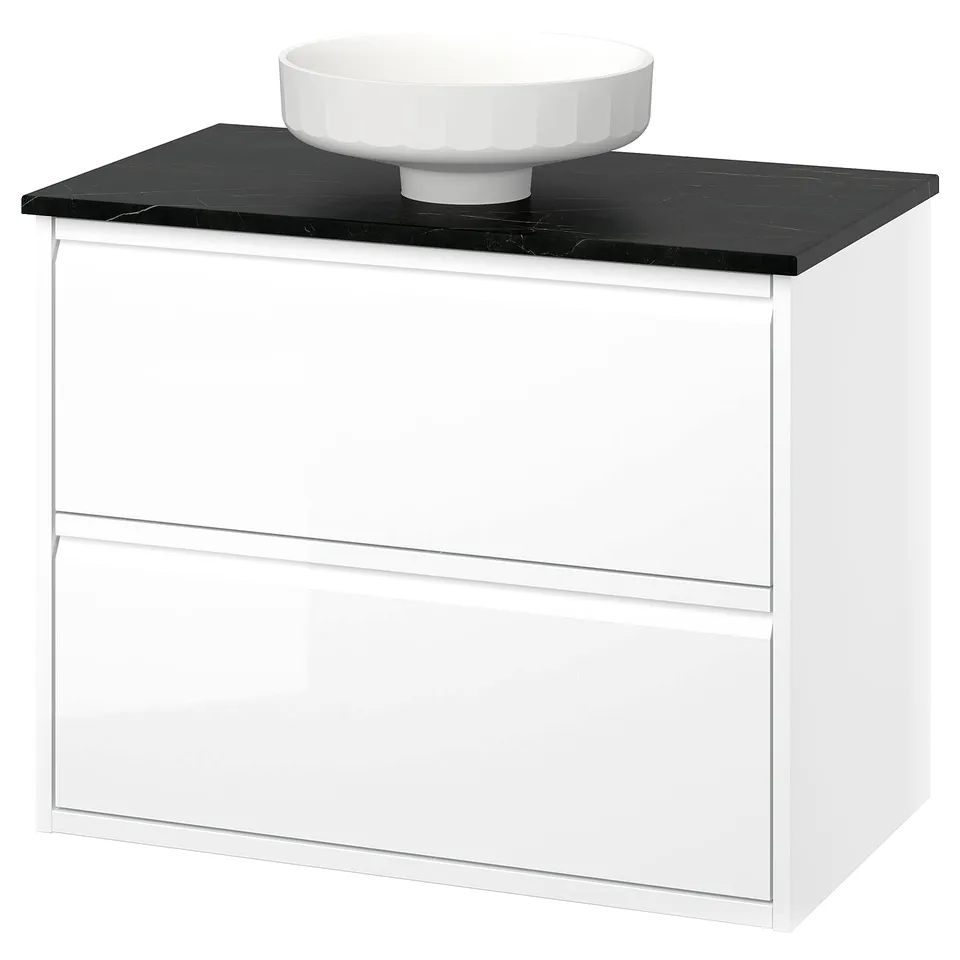 White glossy bathroom vanity with black countertop and round basin. Modern minimalist design.