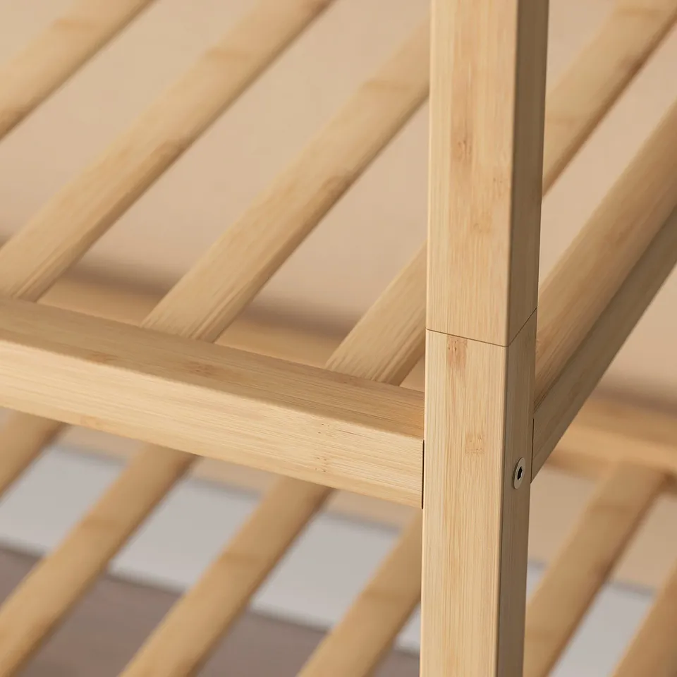 Wooden shoe rack made of durable bamboo, neatly arranged with slats for storage.