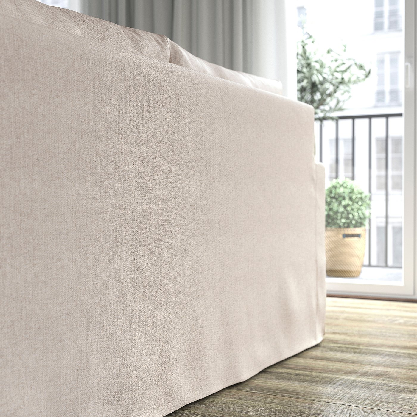 Sofa bed in light fabric, part of living room furniture.