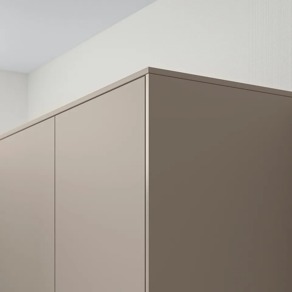 Kitchen corner with beige-brown cabinets, hidden lighting cords.