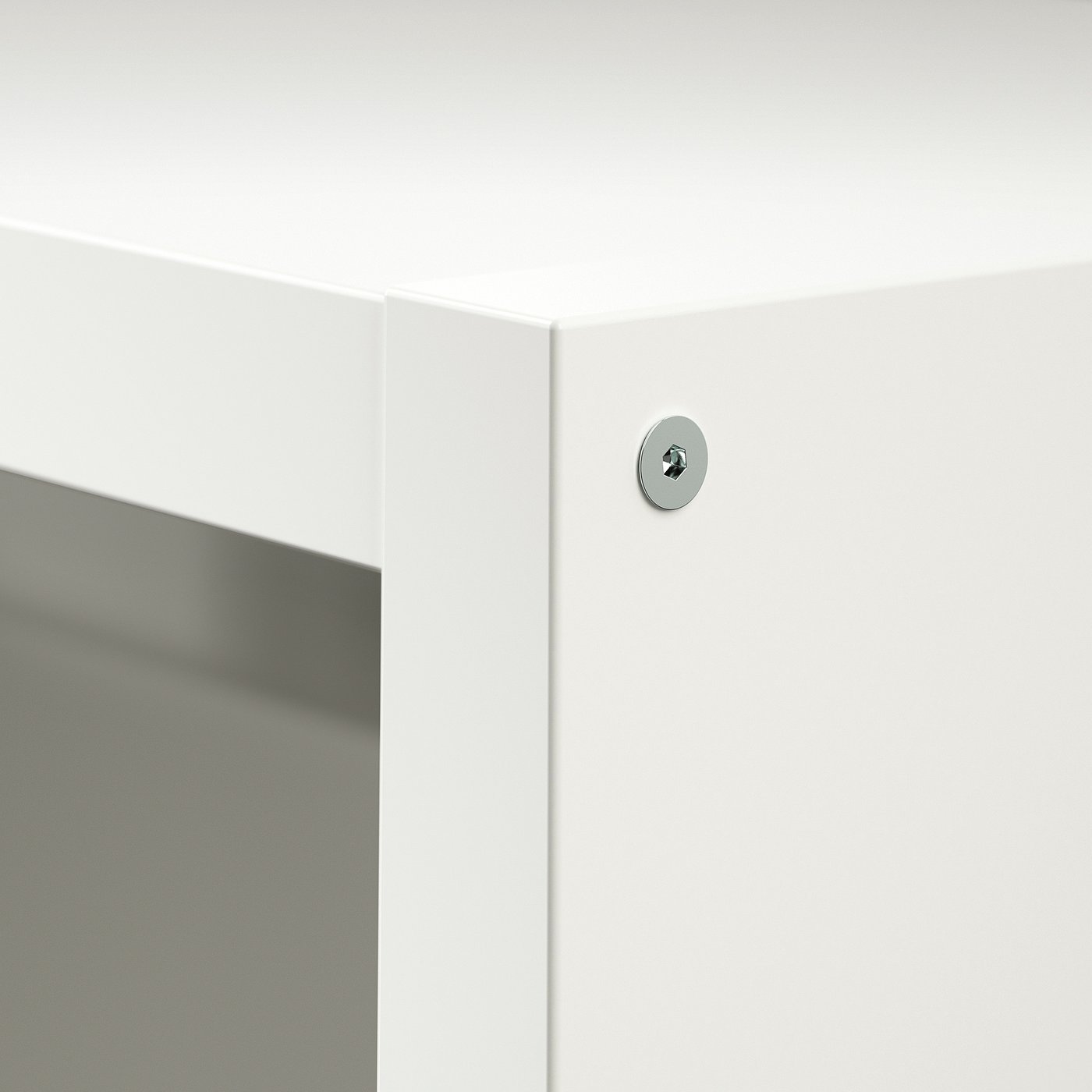 White cabinet corner with circular lock, reflecting surface.