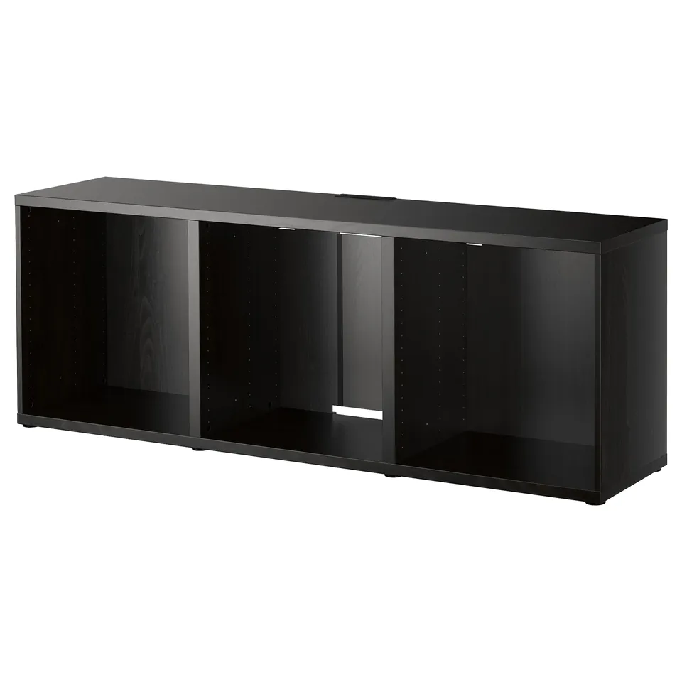 An ikea BESTÅ black tv cabinet. It has a rectangular shape with open compartments and adjustable feet for stability.