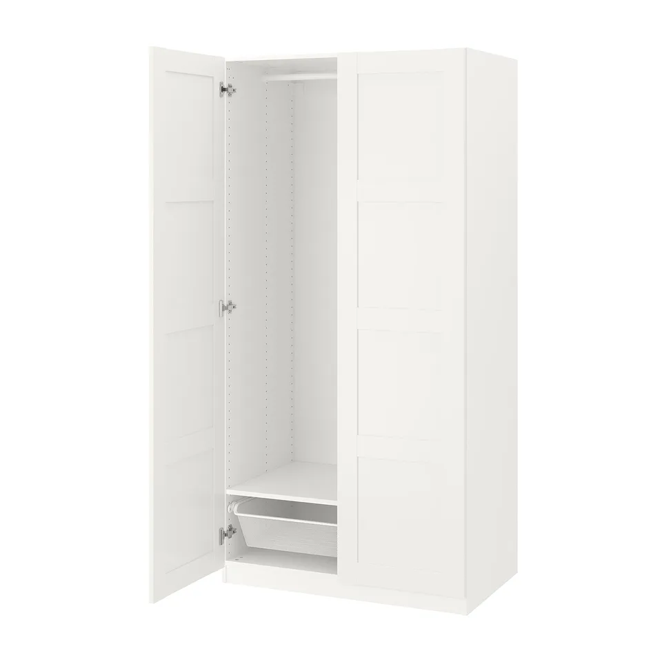 A white PAX wardrobe with one door open, revealing shelves and a mesh basket inside.