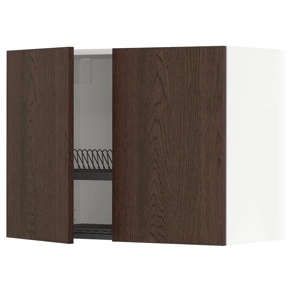 A dark brown wooden METOD kitchen cabinet with one open door, revealing a metal dish rack inside.