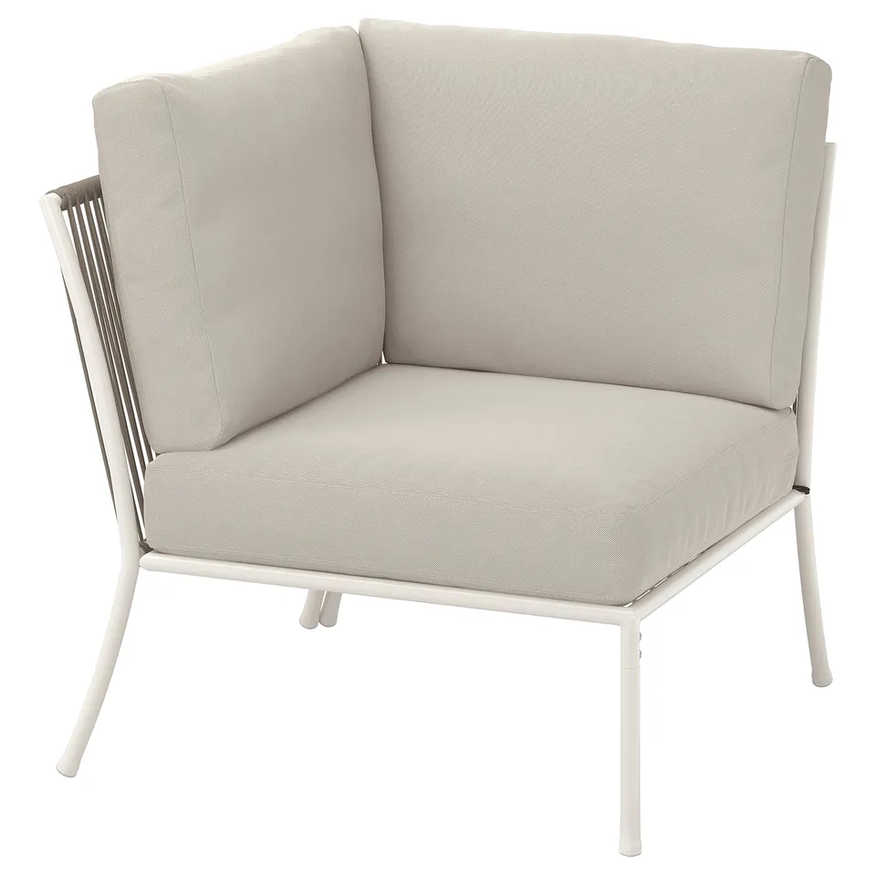 A modern light grey outdoor corner chair with metal legs and cushions. It has a sleek design, perfect for patio seating.
