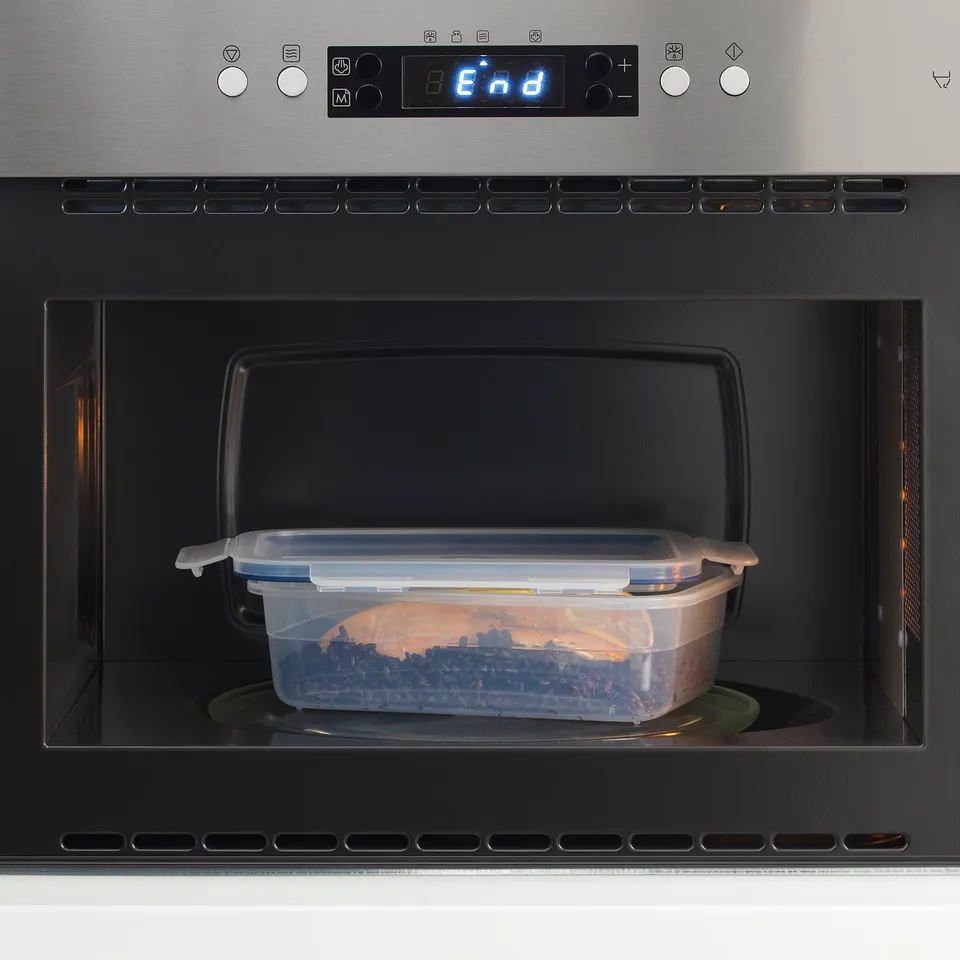 Microwaved food in IKEA 365+ container, reheating leftovers.