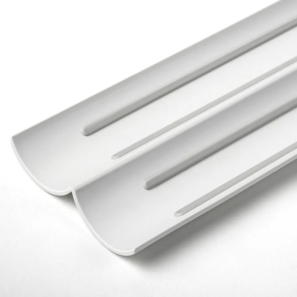 White plastic spice rack insert with anti-slip for organised drawer storage.