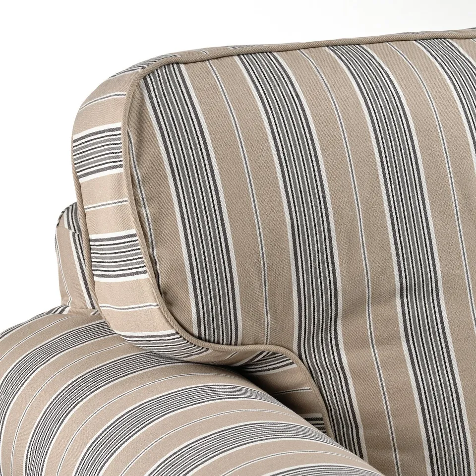 Striped sofa corner with plush, inviting cushions, showcasing quality design and comfort.