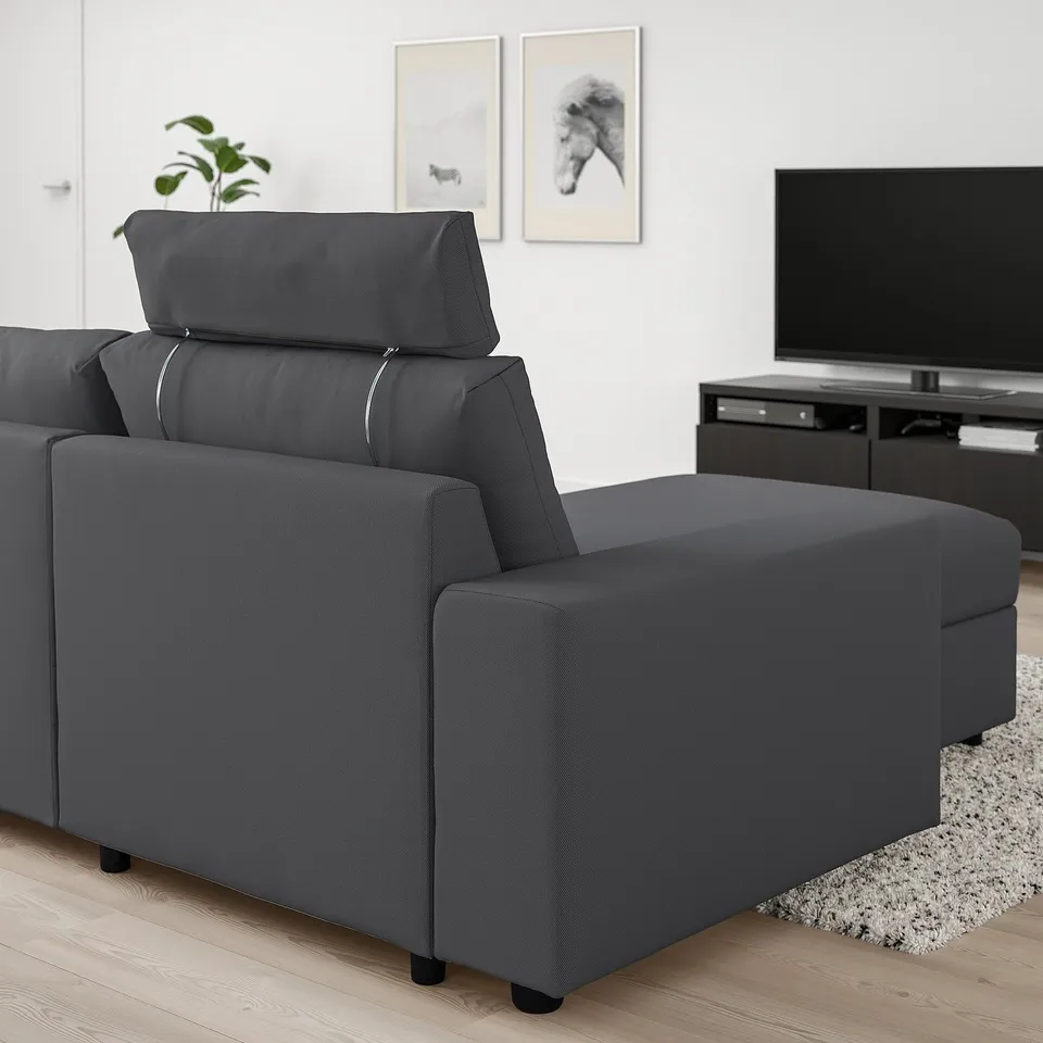 Modern dark grey VIMLE sectional sofa in living room. Adjustable headrest and chaise lounge.