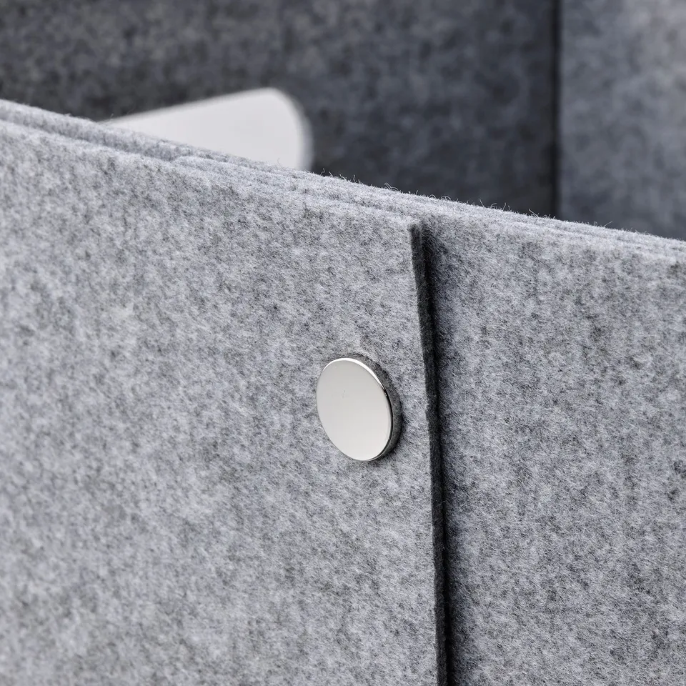 Metal button on grey box; neat, high-quality.