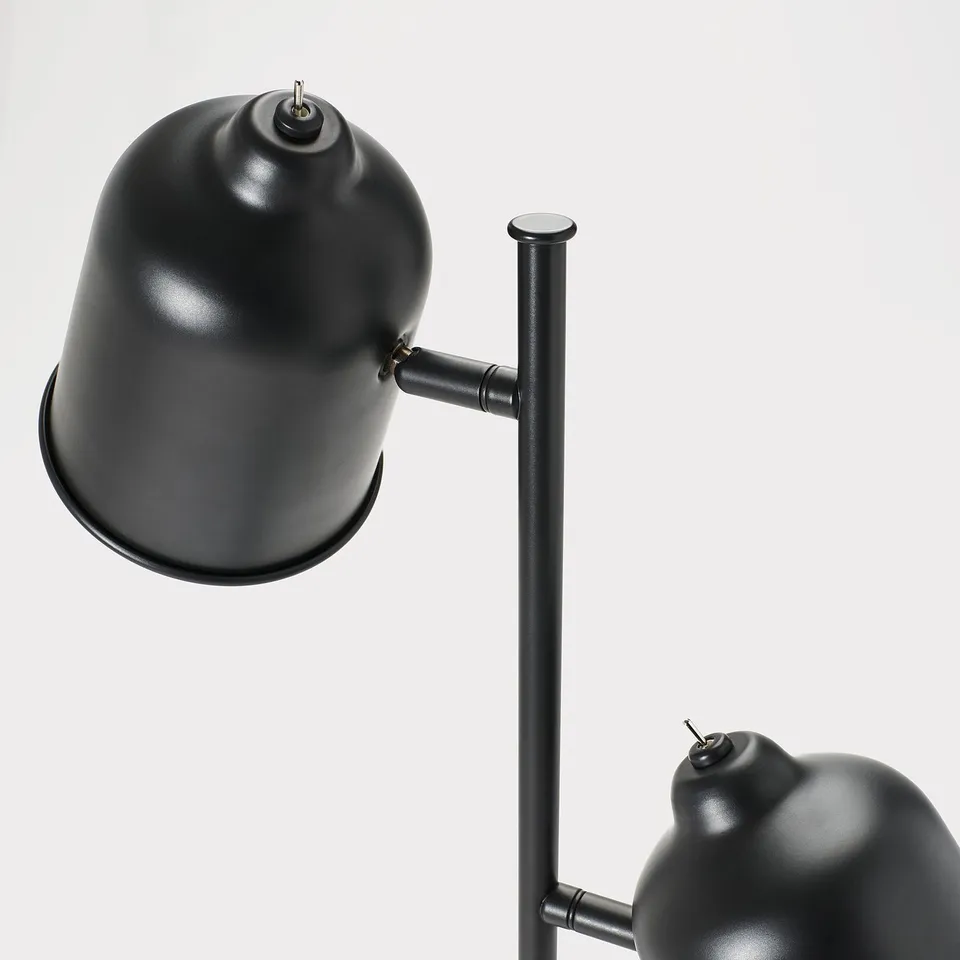 Modern floor lamp with two adjustable black shades on a robust pole. Elegant design with rotary switches.
