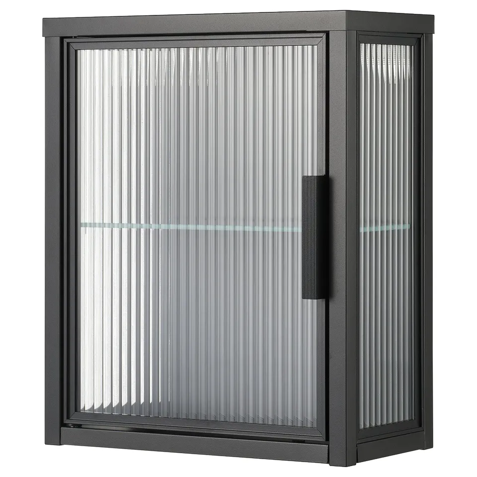 Modern black MOSSJÖN cabinet with reeded glass, sleek handle, magnetic doors, glass shelf.