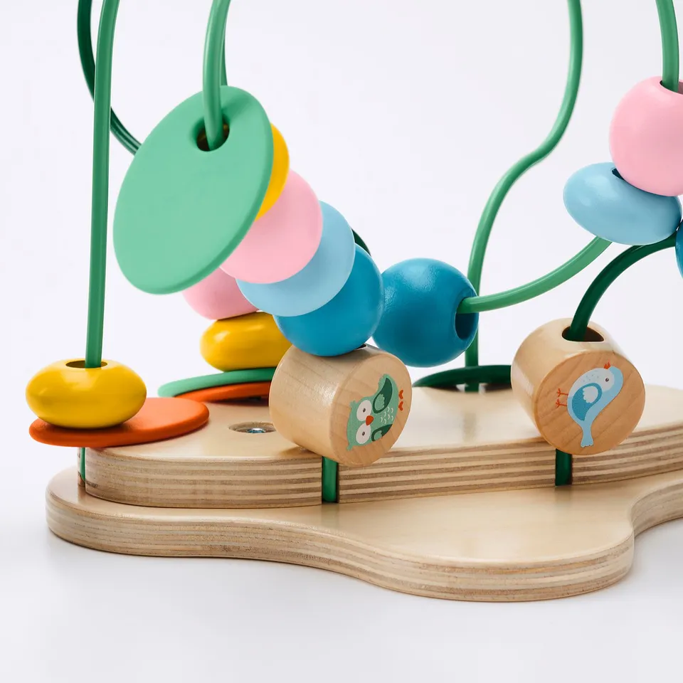 Colourful wooden toy with beads and figures, showcasing high-quality craftsmanship and vibrant, child-friendly design.