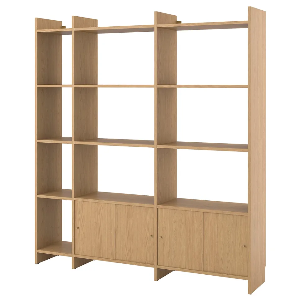 A light wooden LÅDMAKARE shelving unit with cabinets and open slots, designed for space-saving and styling.