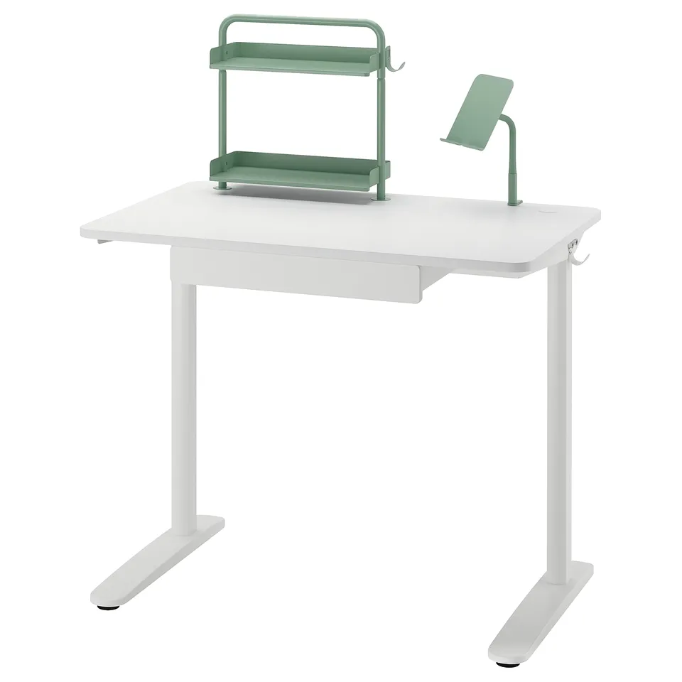 RELATERA white desk with green organiser and lamp, sleek modern design.