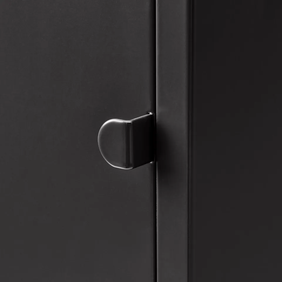 Modern black cabinet with sleek, metal handle.
