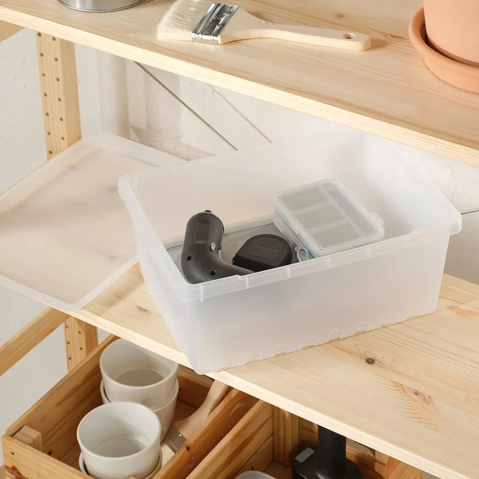 Plastic box lid for UPPSNOFSAD, organised on shelf with cups and tools.