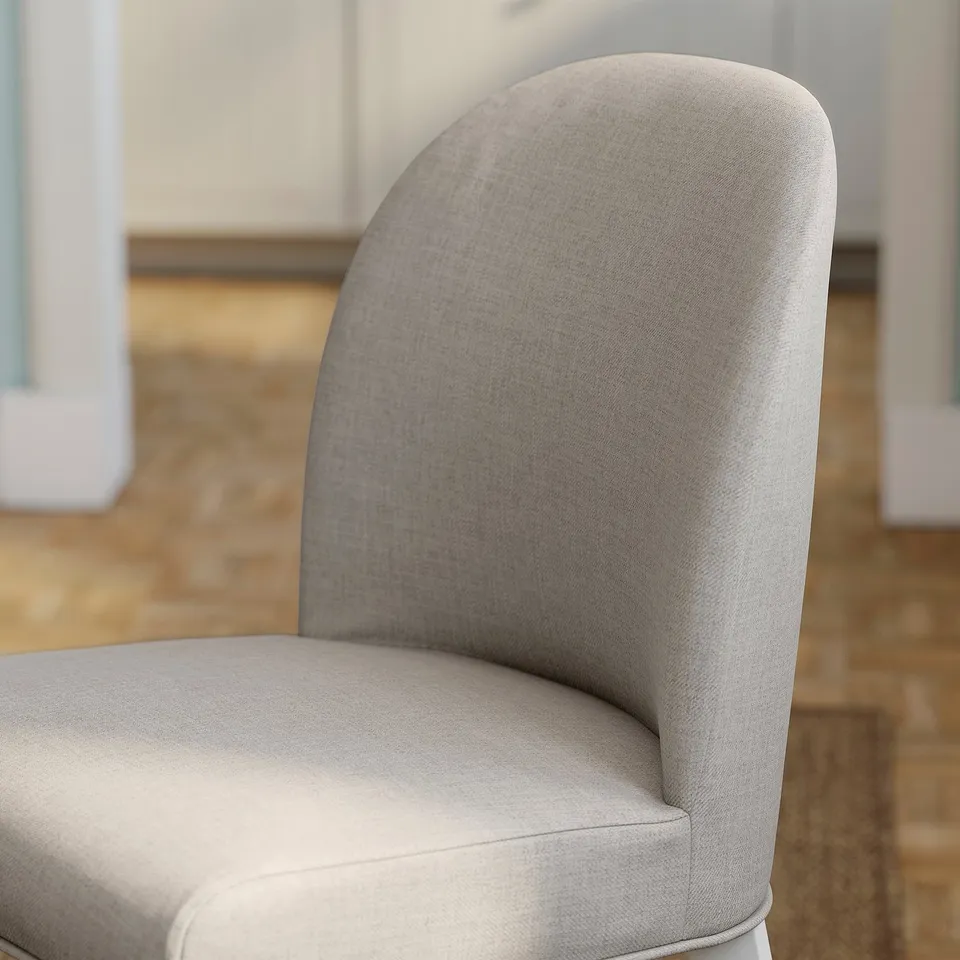 A stylish, upholstered chair with a supportive, curved back and plush seat, highlighting its comfort and quality.