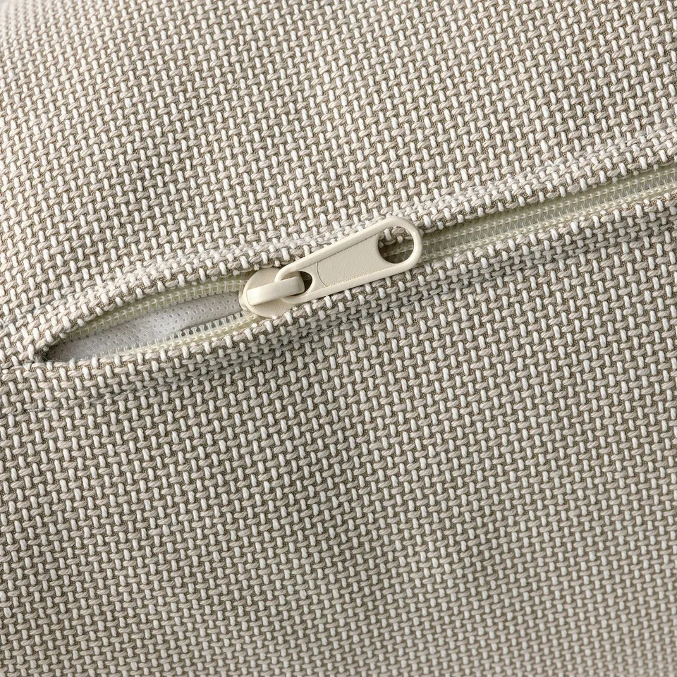 Close-up of zip on durable, woven fabric, showcasing high-quality texture and detail.