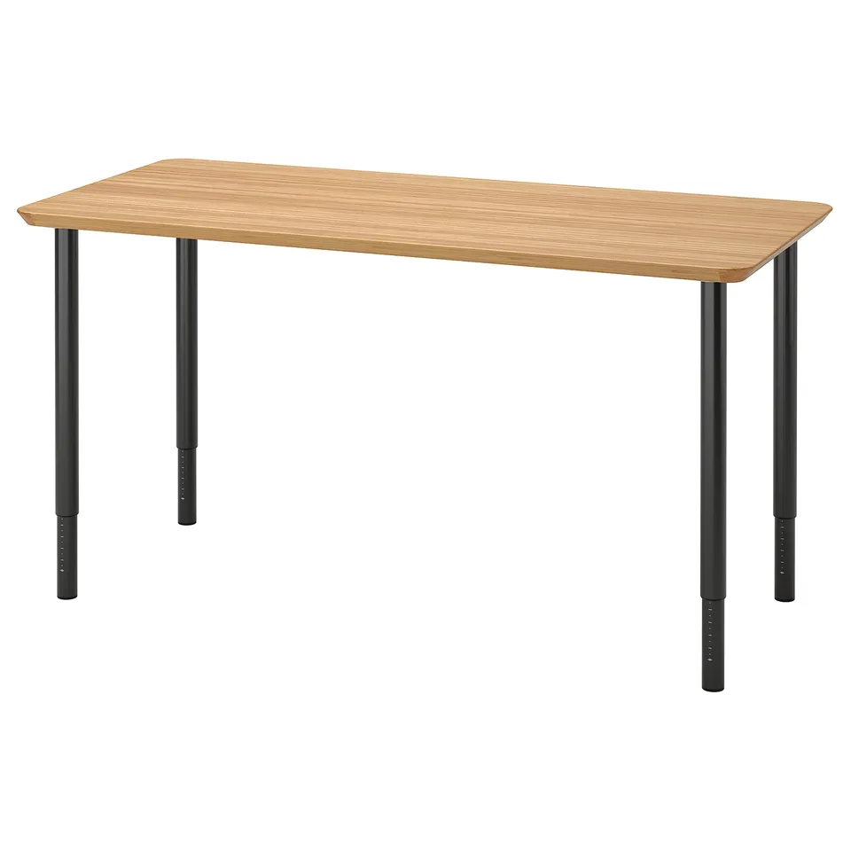 A rectangular desk with a light wood top and black metal legs.