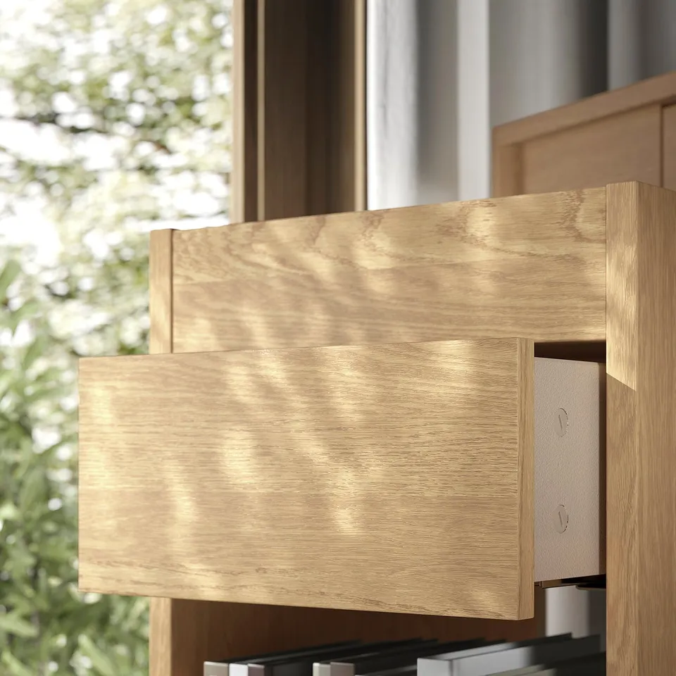 Drawer unit made of oak veneer with smooth finish and soft-close drawers.
